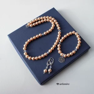 Bransoletka Swarovski Crystal Peach Pearl ze srebrną zawieszką